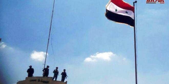 Syria national flag raised over al-Moseifera town in Daraa