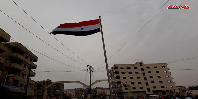 Syria flag raised in Babila in celebration of its liberation